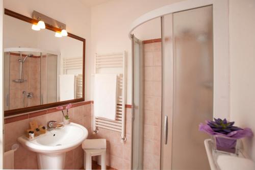 a bathroom with a sink and a shower at Hotel Villa Domizia in Porto Santo Stefano
