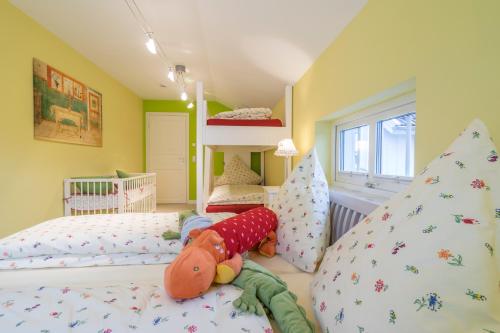 a childs bedroom with two beds and a bunk bed at Villa Scandic Apartments in Rust