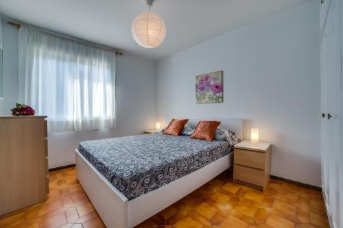 Кровать или кровати в номере Vivalidays Casa Genis