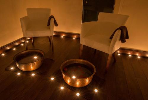 two chairs and a bowl and lights on the floor at Loughrea Hotel & Spa in Loughrea