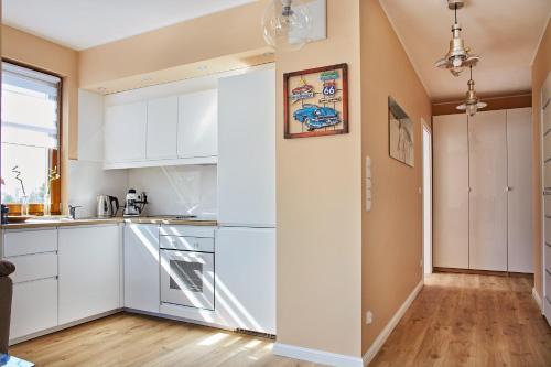 Kuchyňa alebo kuchynka v ubytovaní Sun Apartament - Królewskie Kamieniczki
