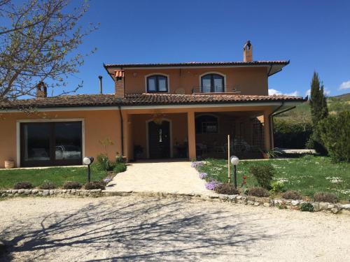 a house with a driveway in front of it at Bed & Breakfast Le Piagge in Scurcola Marsicana