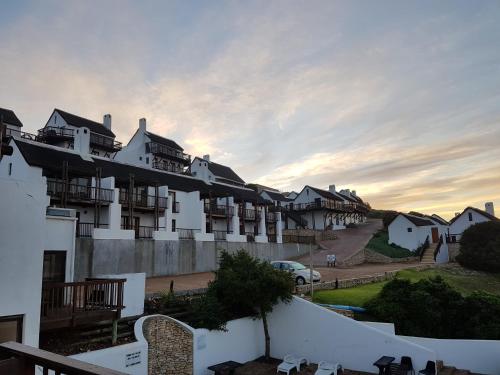 arial view of a building in a town at Breede River Lodge in Witsand