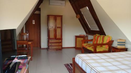 Giường trong phòng chung tại Pousada Castelinho