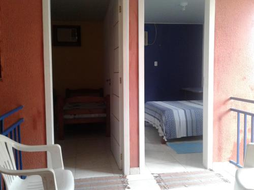 a room with a bedroom with a bed in it at Pousada da Didi in Belém