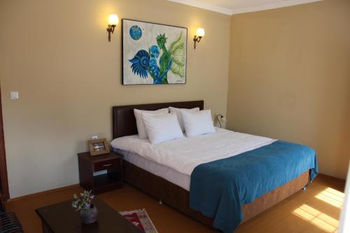 מיטה או מיטות בחדר ב-Utopia Lodge Hotel