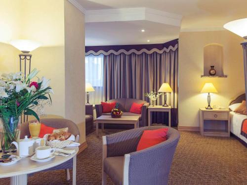 Coin salon dans l'établissement Novel Hotel City Center