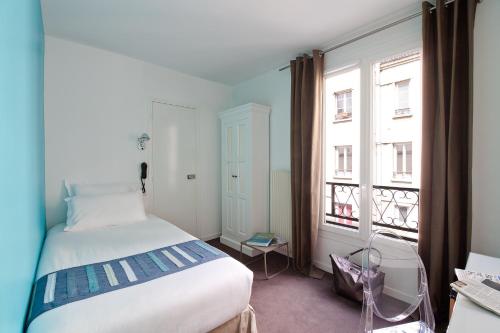 Giường trong phòng chung tại Hôtel Marais de Launay