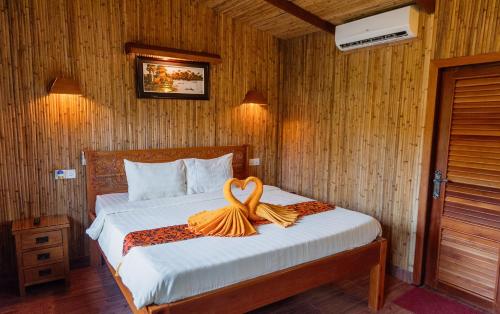 Postel nebo postele na pokoji v ubytování Sok Sabay Resort