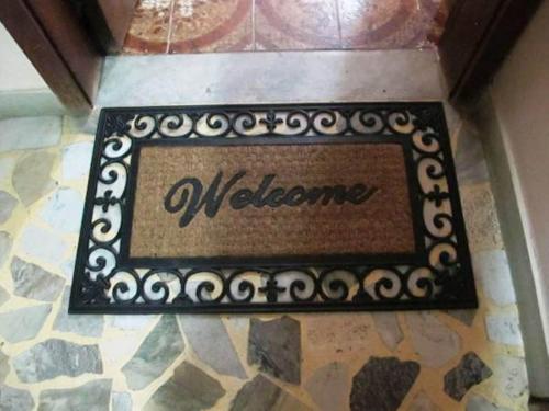 a welcome sign on the floor of a room at Apartamento Copacabana Mar in Rio de Janeiro