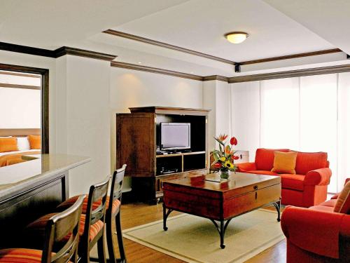 a living room with a couch and a table at Hotel Casa Veranda Guatemala in Guatemala