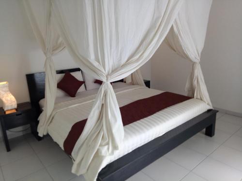 Ένα ή περισσότερα κρεβάτια σε δωμάτιο στο Villa Esa Ubud