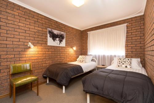 Postel nebo postele na pokoji v ubytování Mildura Holiday Apartments