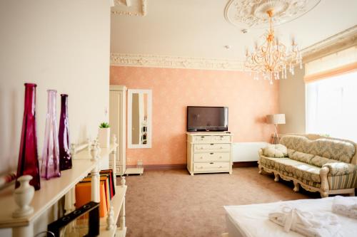 TV a/nebo společenská místnost v ubytování Hotel 19