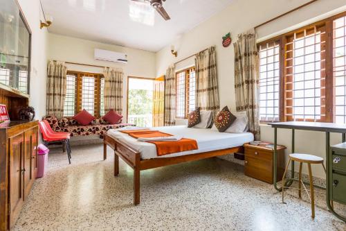 Ένα ή περισσότερα κρεβάτια σε δωμάτιο στο Thoms Beach Homestay