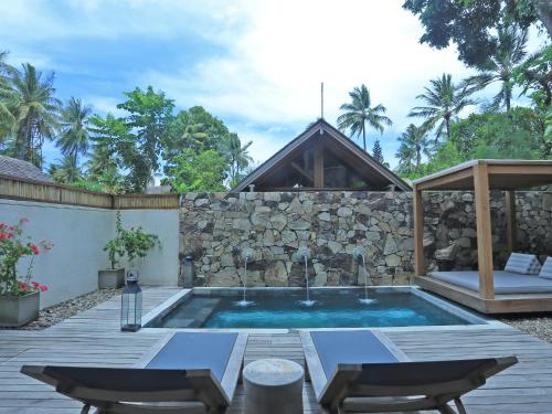 Der Swimmingpool an oder in der Nähe von Jeeva Santai Villas