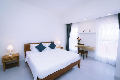 Cama o camas de una habitación en Sun Apartment