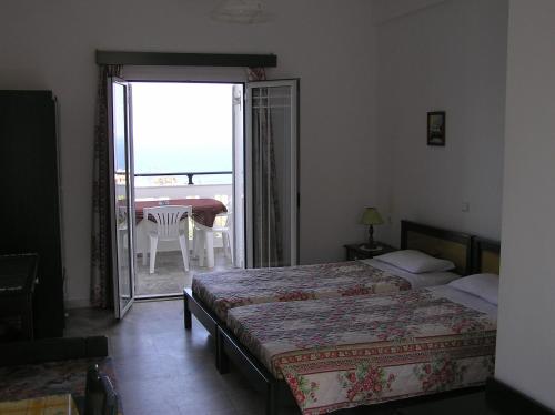 Кровать или кровати в номере Knossos