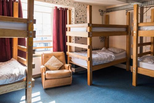 
A bunk bed or bunk beds in a room at The Full Moon Backpackers
