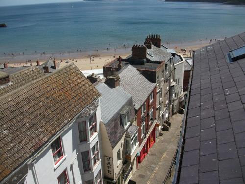 a view of a beach and buildings and the ocean at Blands Cliff Lodge in Scarborough