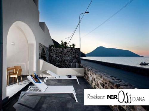 a room with a view of the ocean at NerOssidiana in Acquacalda