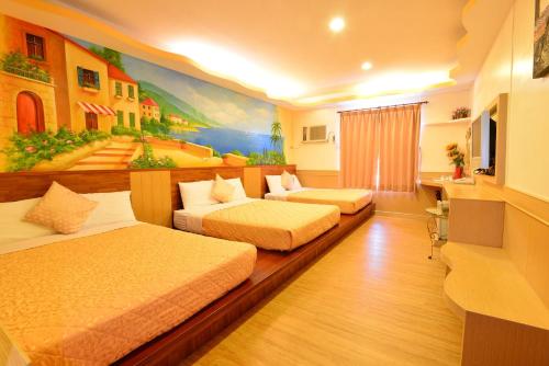 เตียงในห้องที่ Bashi Channel Vacation B&B