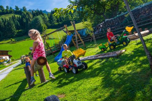 a group of children playing on a playground at Tobhartbauer in Dorfgastein