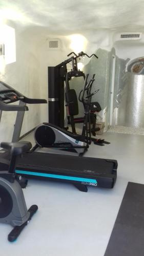a gym with a treadmill and a exercise bike at Hotel Orsa Maggiore in Anacapri