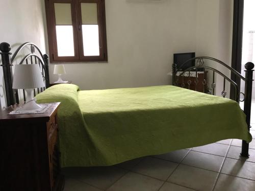 A bed or beds in a room at Affittacamere Peonia
