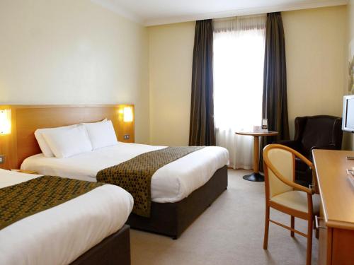 Postel nebo postele na pokoji v ubytování Great National Hotel Ballina