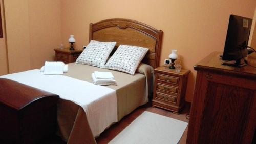 En eller flere senge i et værelse på La Bouganvilla