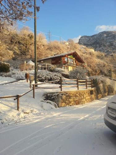 a house on the side of a mountain in the snow at Ristoro Saint Roch in Hone