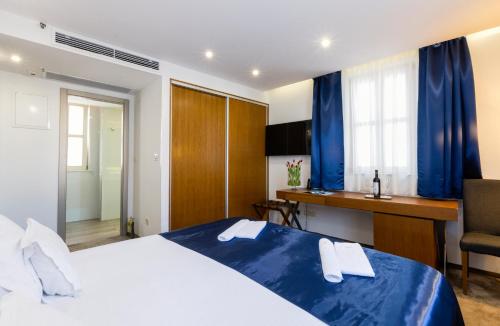 Postel nebo postele na pokoji v ubytování Hotel Marul