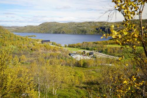 a view of a lake from a hill at Snowhotel Kirkenes in Kirkenes