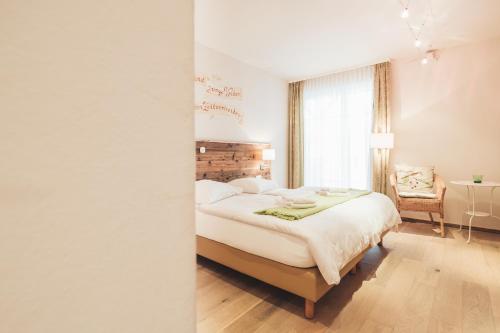 Ένα ή περισσότερα κρεβάτια σε δωμάτιο στο Weinwirtshaus Wlaschits