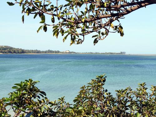 a view of the water from a tree at Bilene Lodge by Dream Resorts in Vila Praia Do Bilene