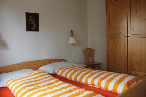 Ein Bett oder Betten in einem Zimmer der Unterkunft Residence Lärchenhäusl