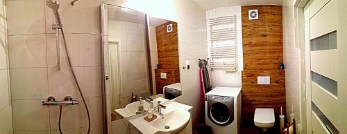 Kúpeľňa v ubytovaní Apartament Solna 106