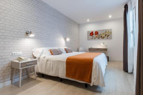 Postel nebo postele na pokoji v ubytování Hostal Menurka