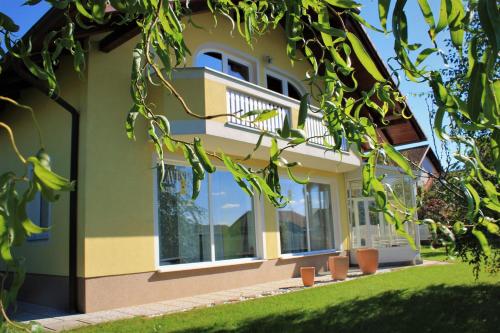 a building with windows and green and yellow at Yellow Dreamhouse in Postojna