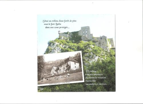 a book with a picture of a castle on a mountain at L'Ermitage St. Roch in Salins-les-Bains