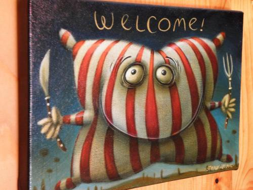 a sign with a drawing of an octopus at Penzion Muran in Terchová
