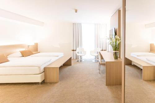 เตียงในห้องที่ relexa hotel München