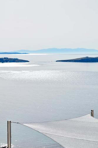 a view of a body of water with a pier at Absolute Mykonos Suites & More in Mikonos