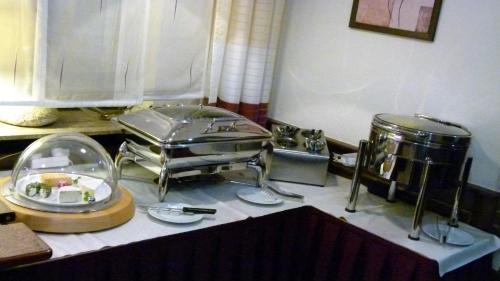 a kitchen counter with a counter top with a buffet at Hotel Bürgerhof in Homburg