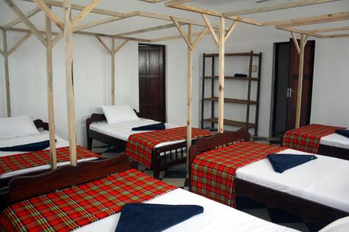 Postel nebo postele na pokoji v ubytování Kimte Beach Lodge