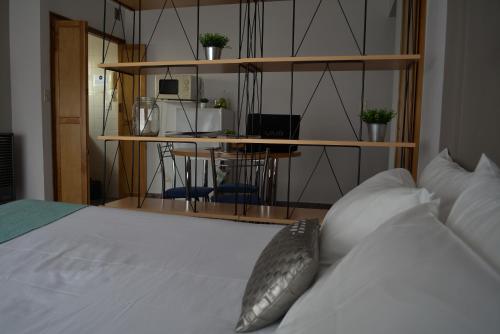 Postel nebo postele na pokoji v ubytování Argenta Apart Hotel