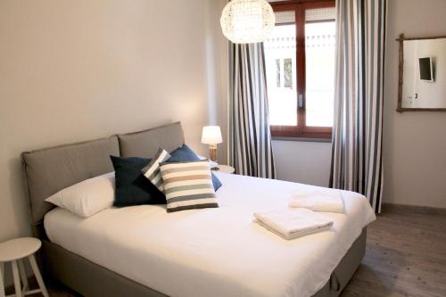 Ένα ή περισσότερα κρεβάτια σε δωμάτιο στο Le Grand Bleu