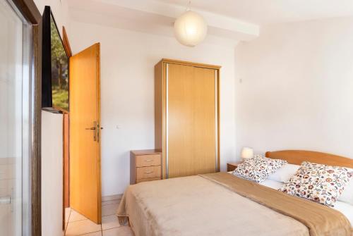 Katil atau katil-katil dalam bilik di Apartments Renata