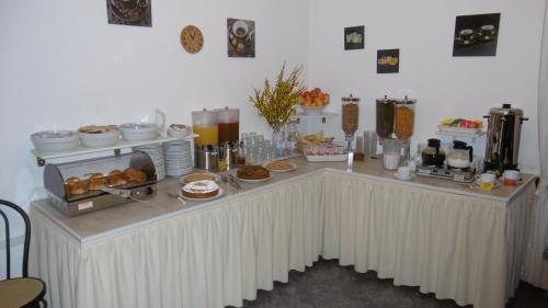 a table with a buffet of food on it at Hotel Riviera in Arenzano